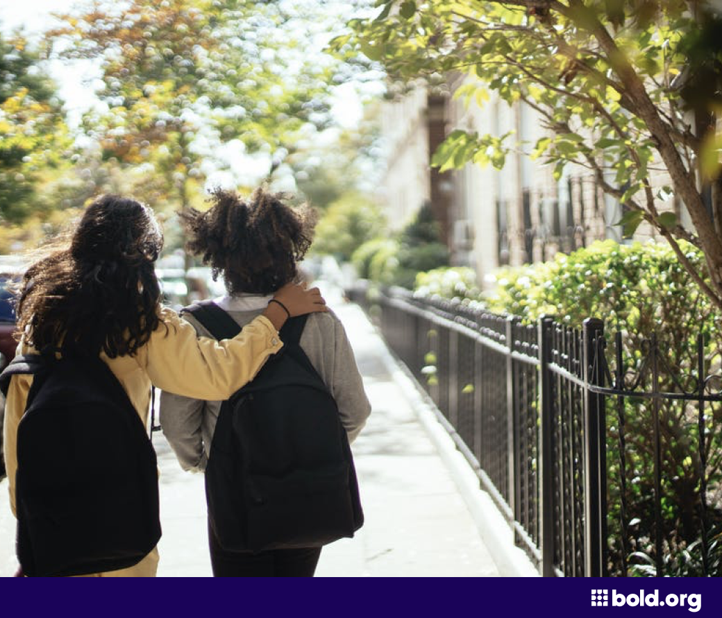 Students with backpacks walking back from school