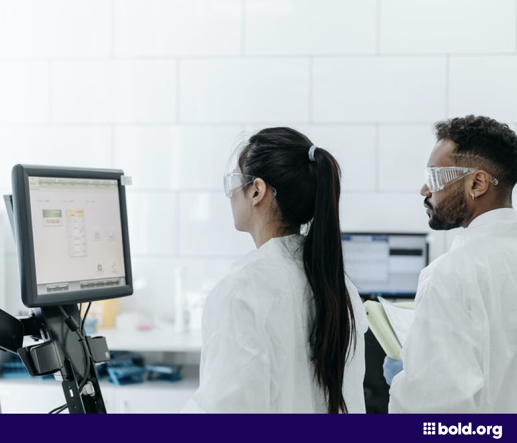 Woman and man looking at a computer in a lab