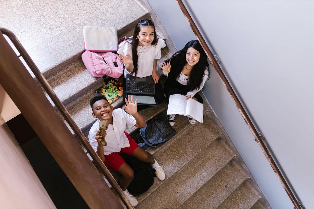 Students studying on a school staircase