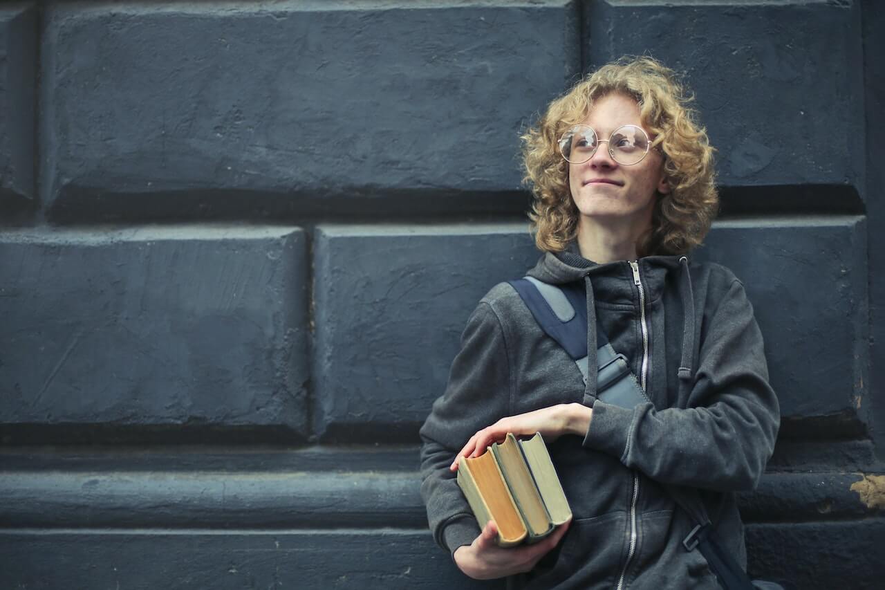 student holding books