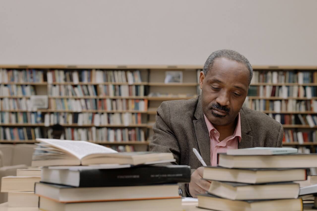 professor taking notes at desk