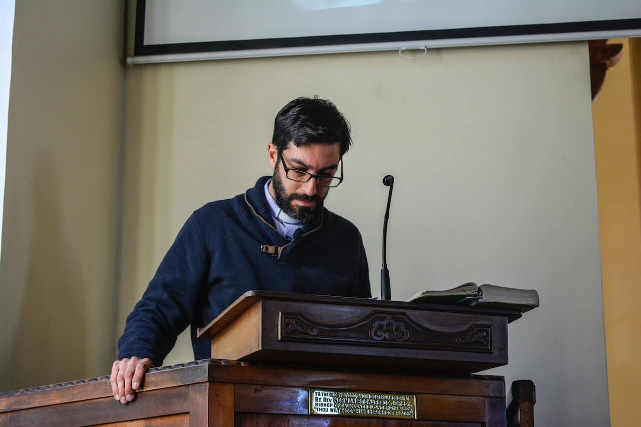 professor giving a lecture at podium