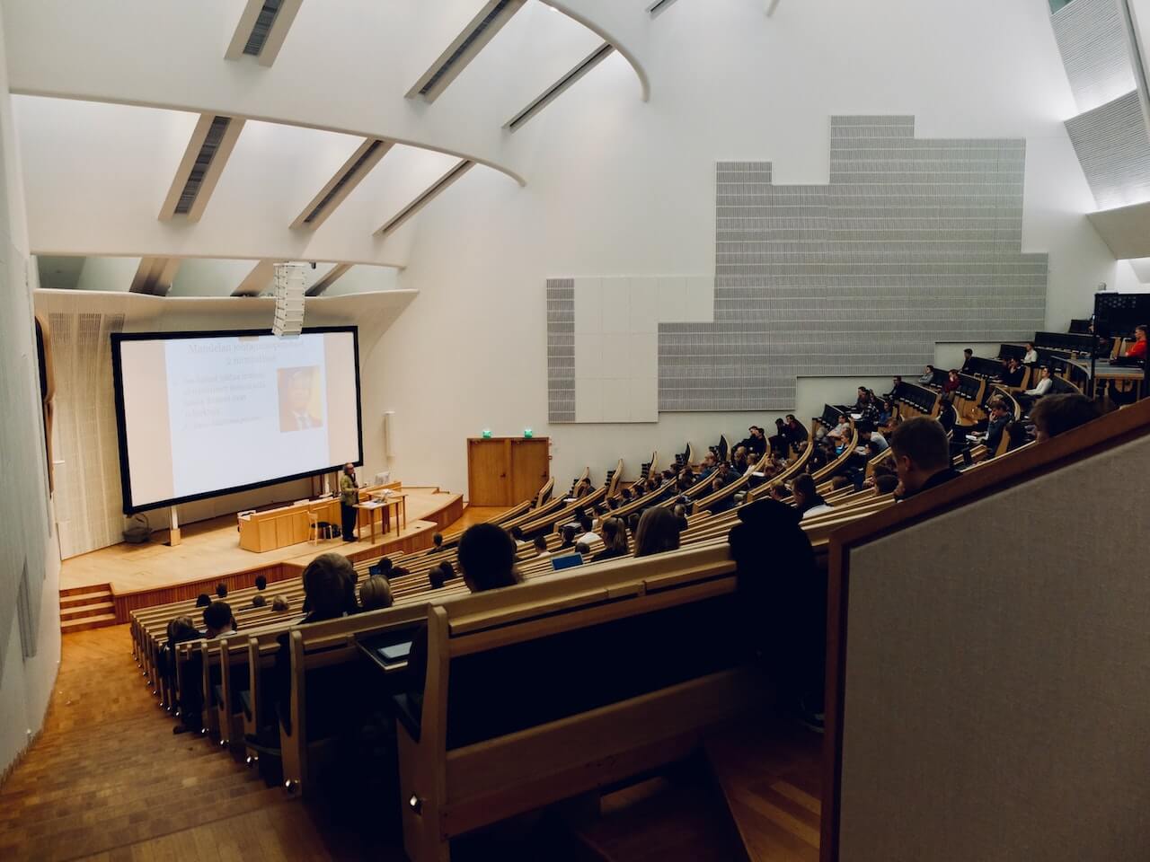 college students in lecture hall on college campus