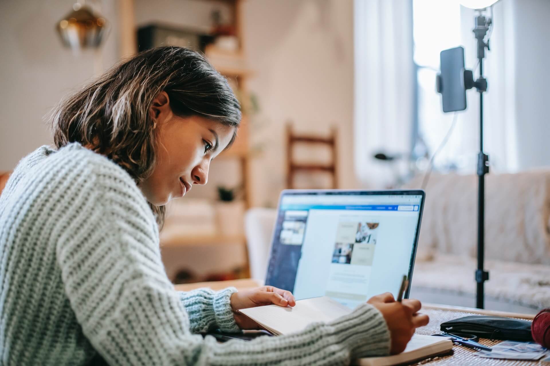 Student studying on a laptop at her desk