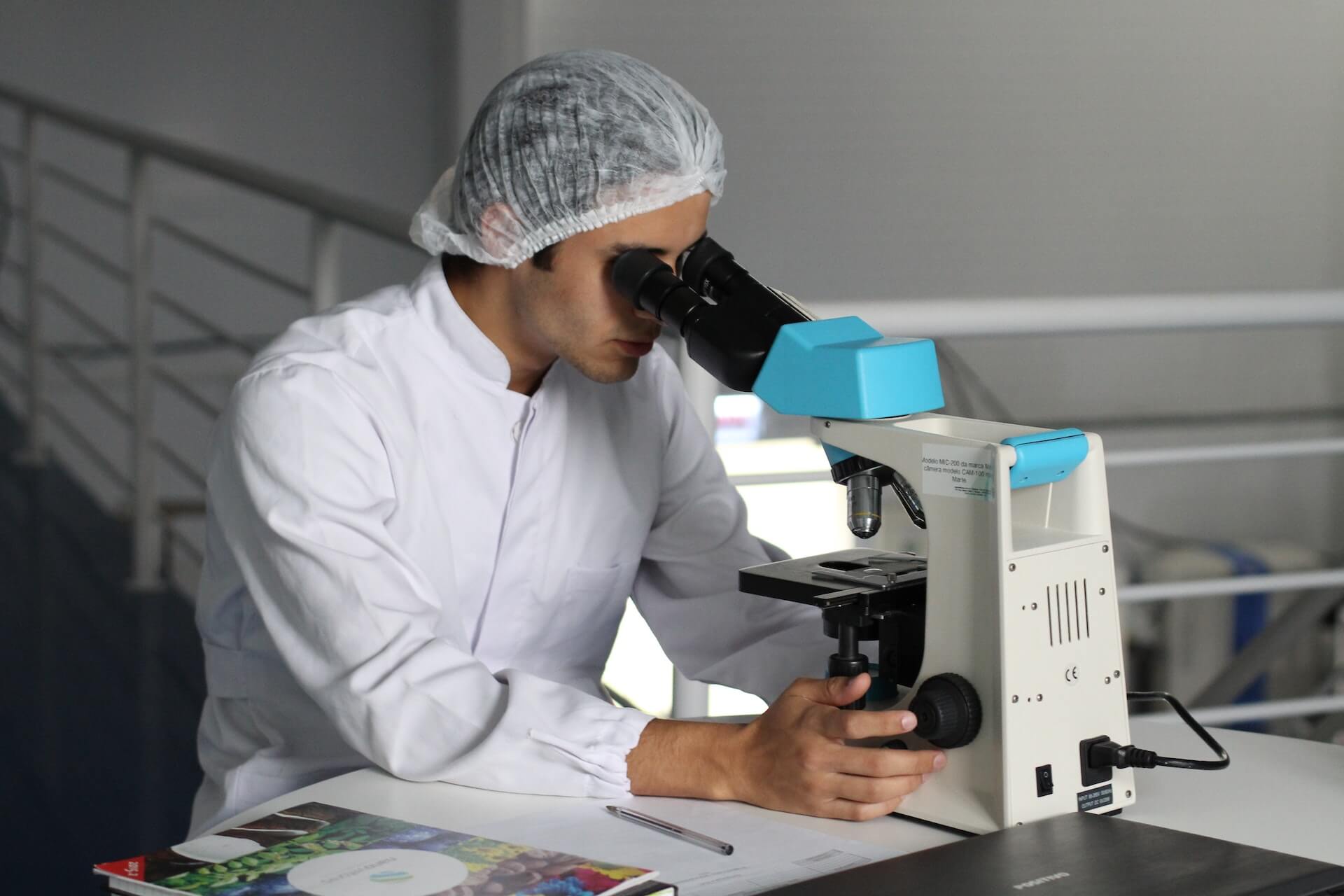 Medical student looking into a microscope
