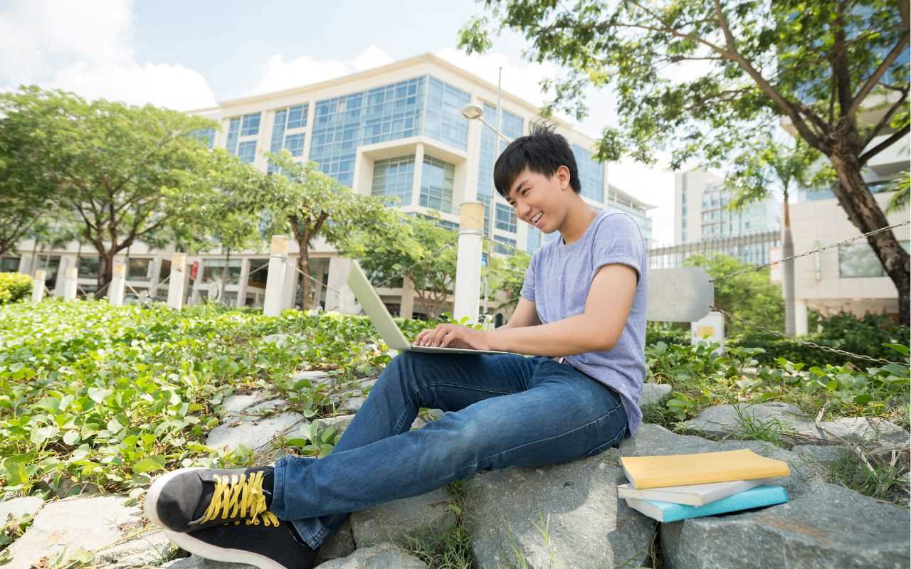 student studying outside