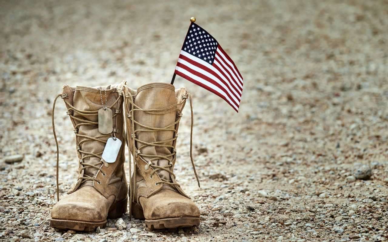 military boots with american flag and dog taga