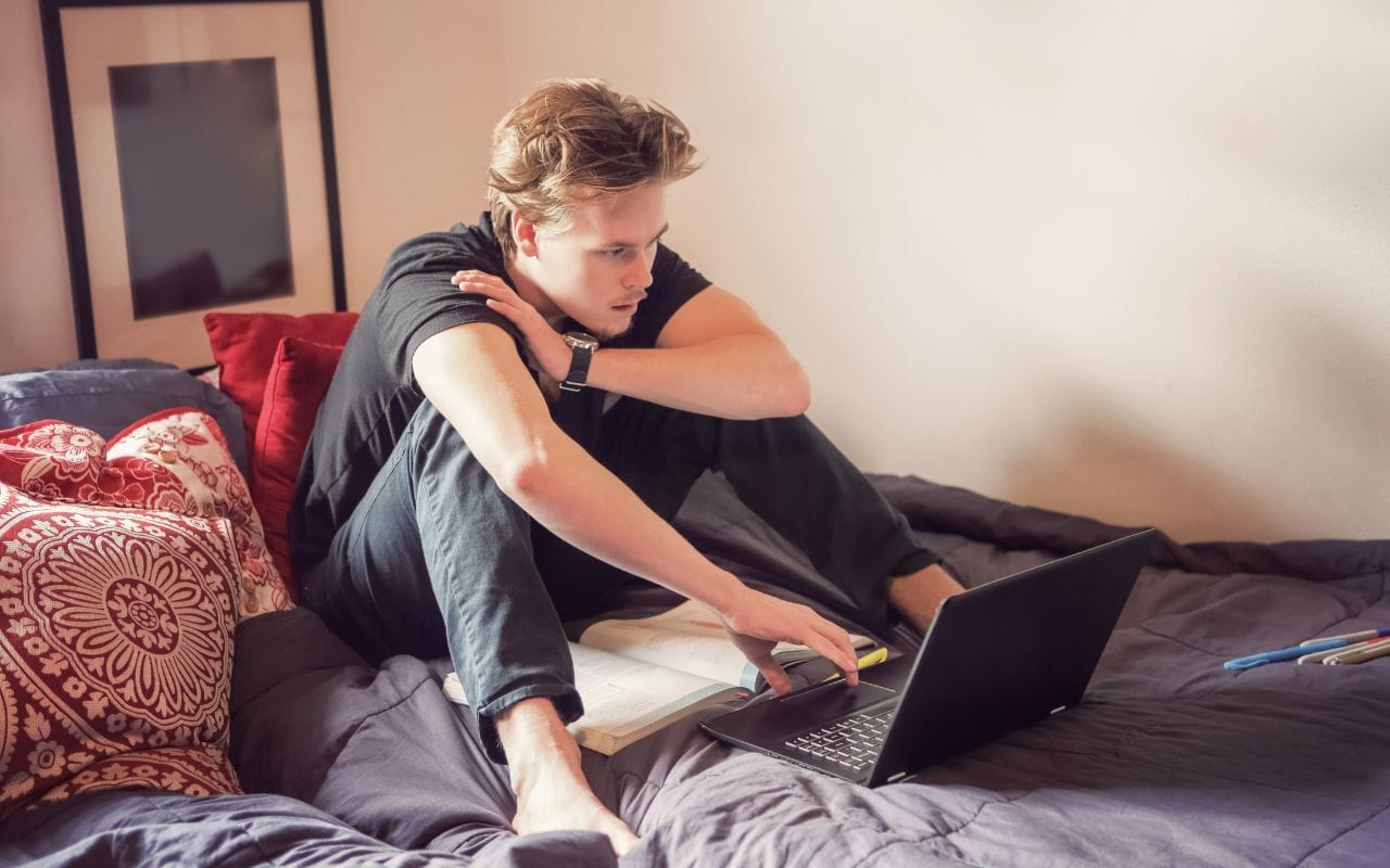 college guy studying in room