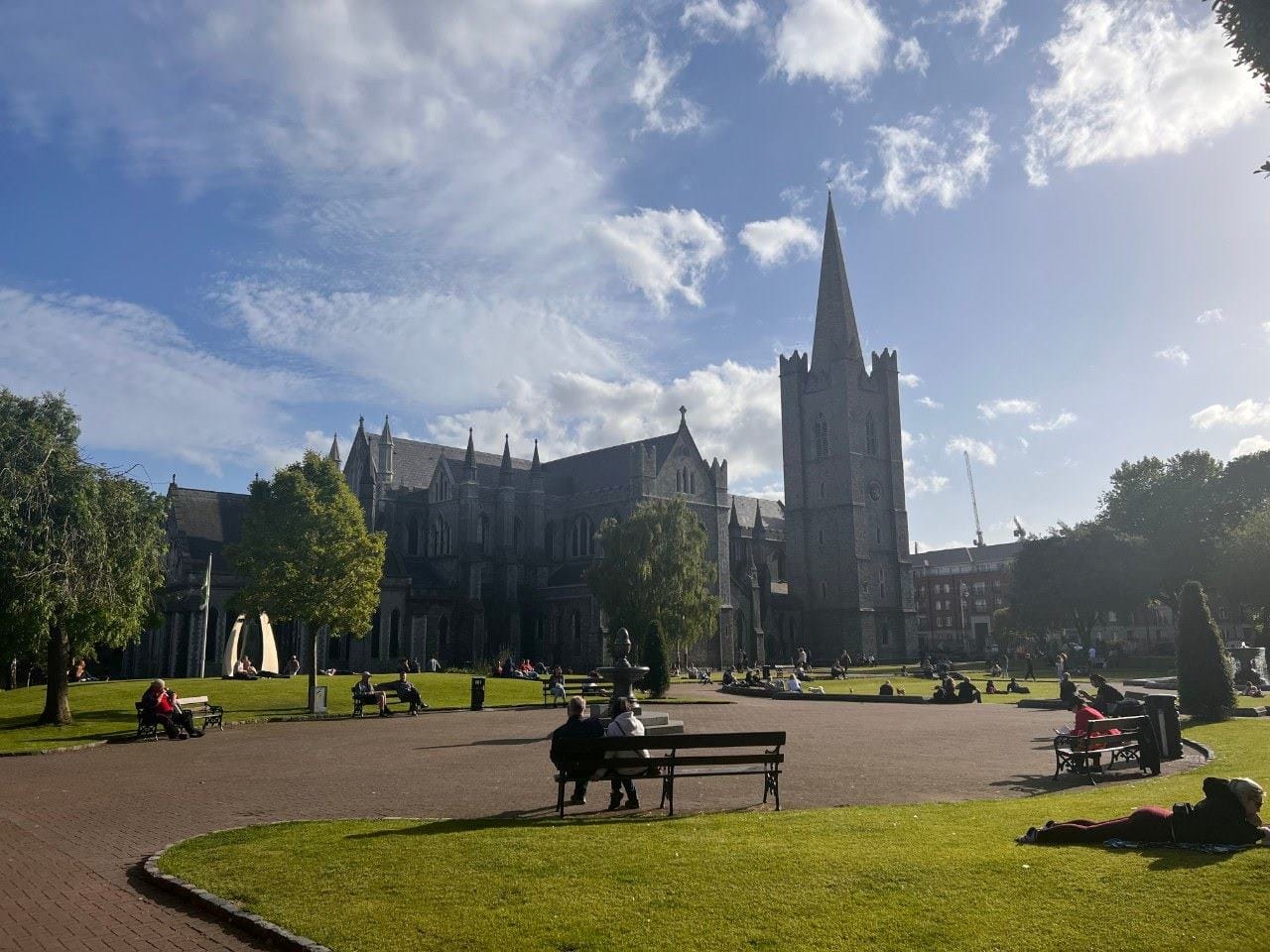 college campus with students studying