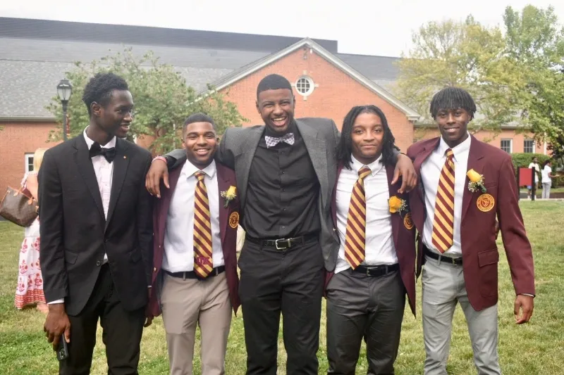 football scholarship recipients in suits