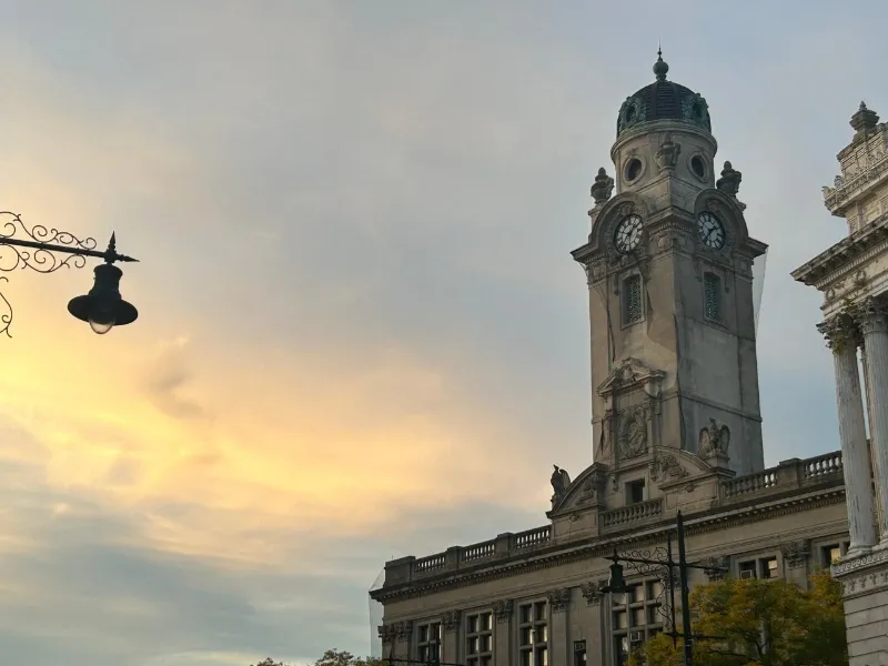 college lecture hall building with bell tower