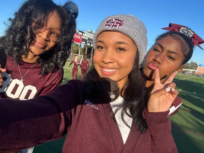 three female students wearing maroon HBCU school merchandice