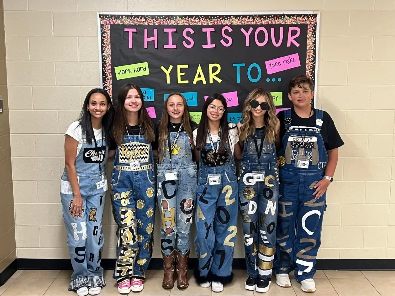 high school students in overalls