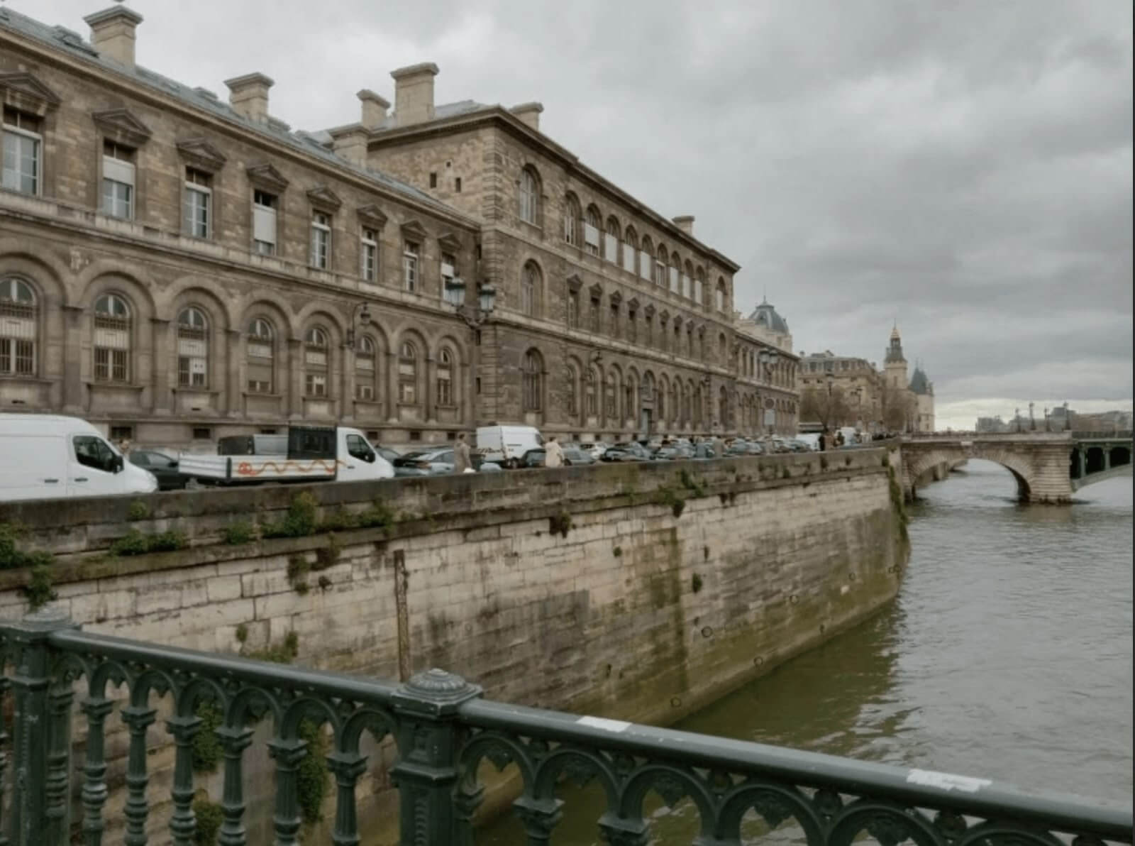 old college building beside a river