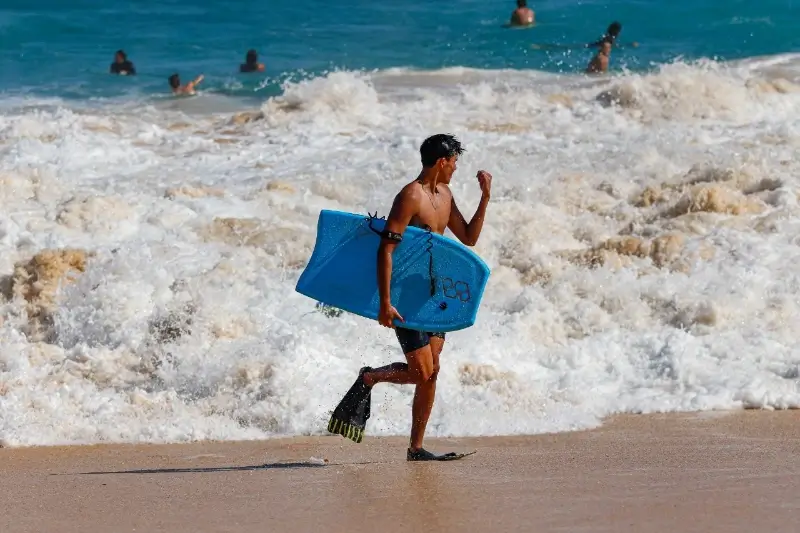 california student surfs in his free time