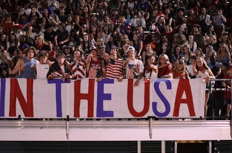 students with a USA sign