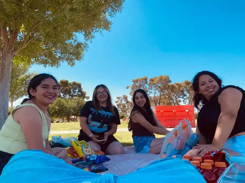 students eat snacks outdoors for spring break